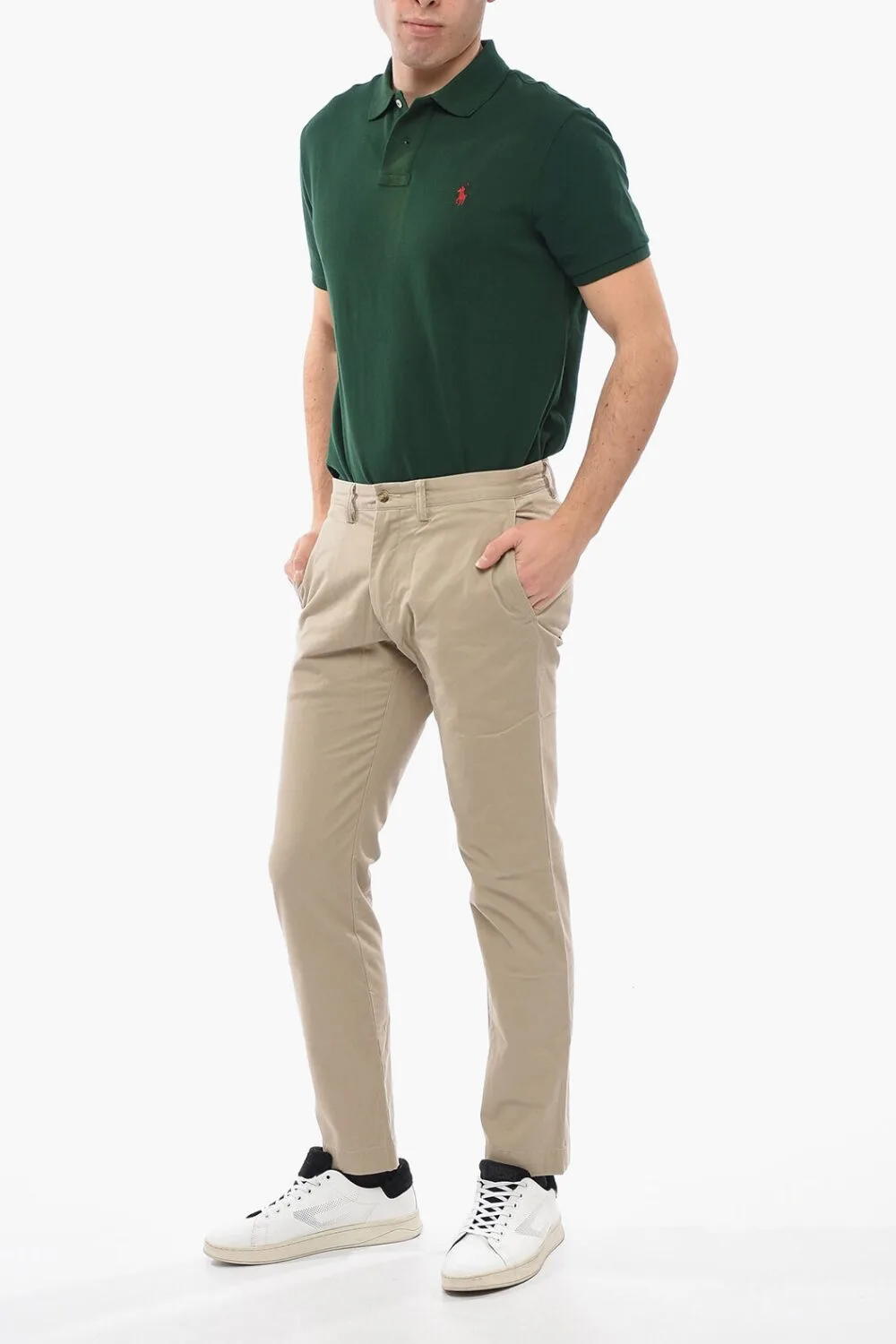 A man wearing a green polo shirt and beige chino — a clean and casual warm-weather look.