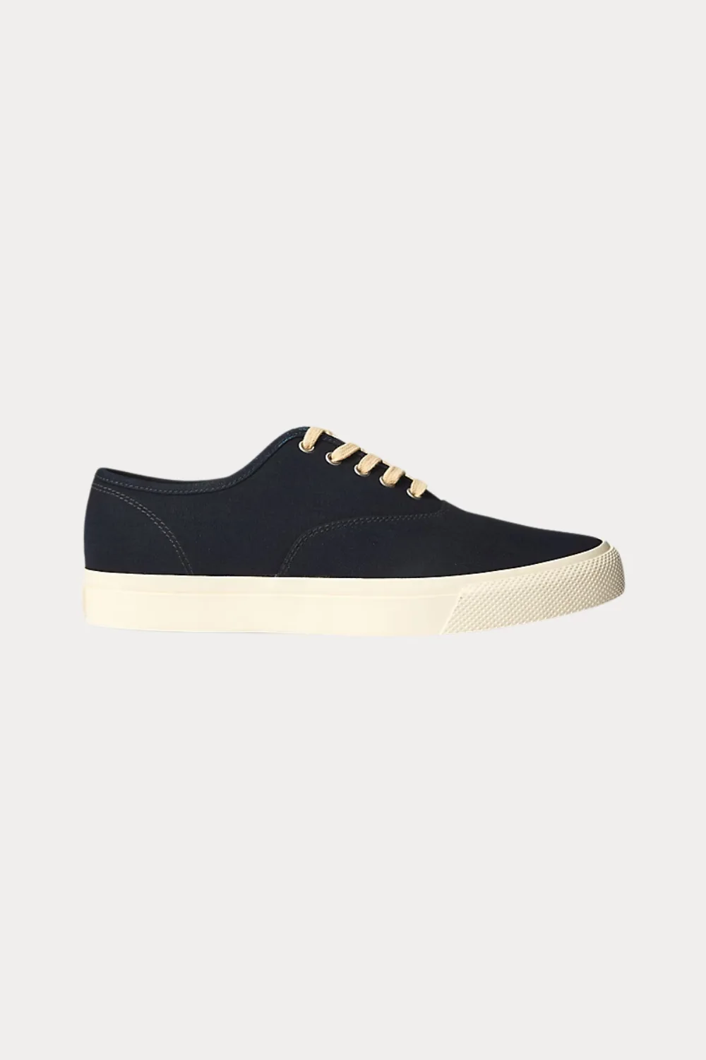 A black canvas sneaker — lightweight and breathable, perfect for everyday summer wear.
