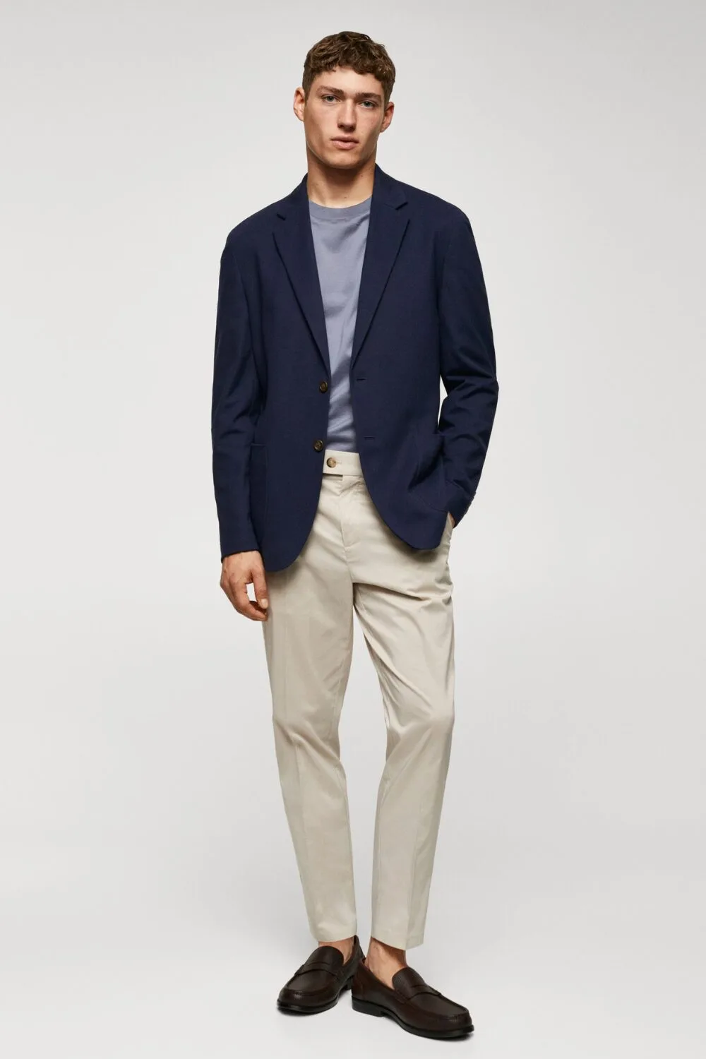 A navy unstructured linen blazer — perfect for A/C-blasted offices or a chilly summer date night.