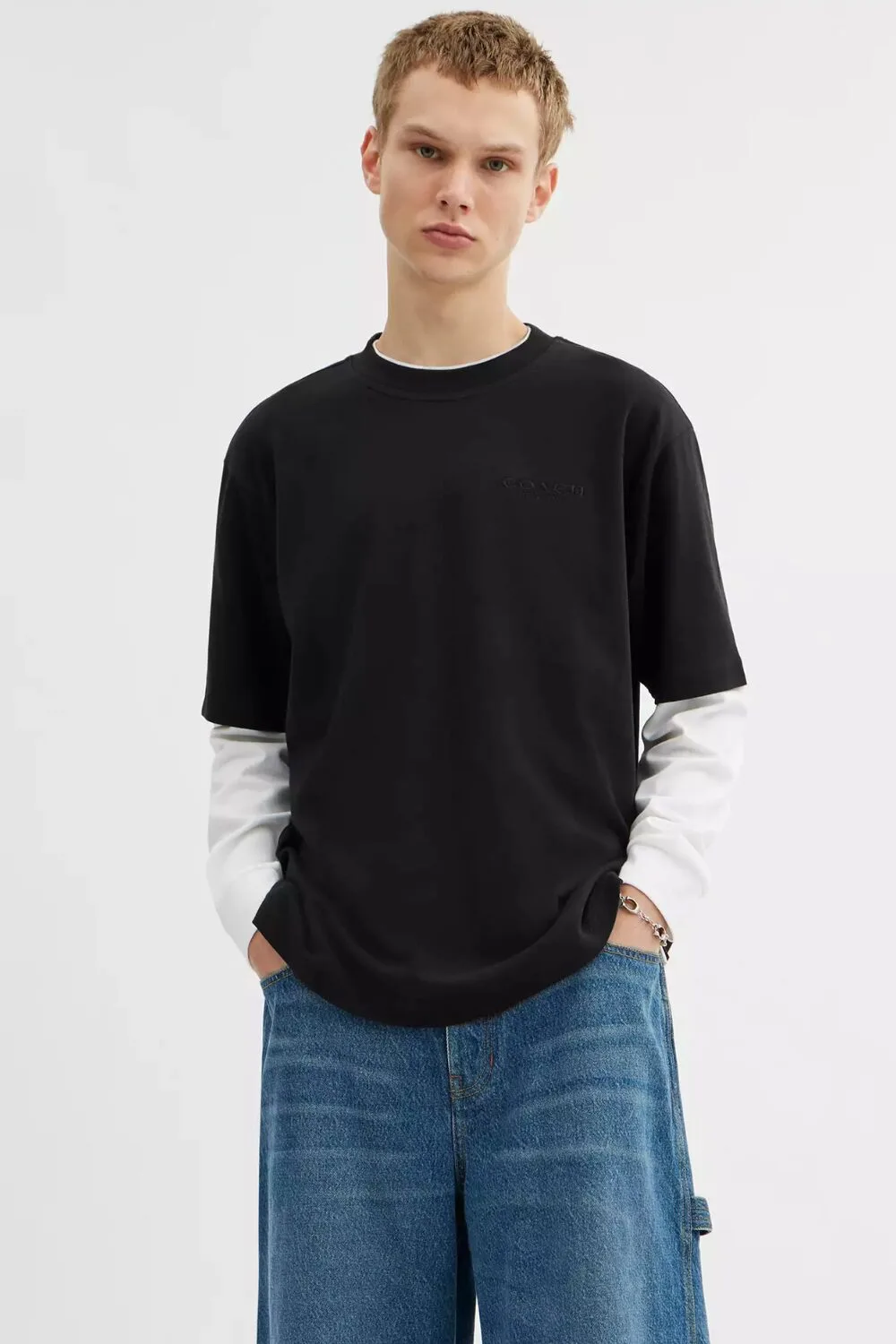 A black knitted cotton tee — lightweight and versatile, perfect for effortless summer style.