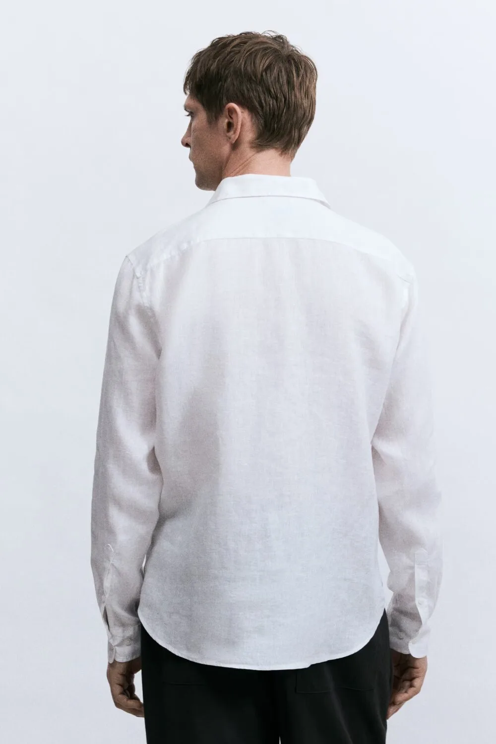 Back view of H&M slim linen shirt – budget-friendly breathable summer menswear