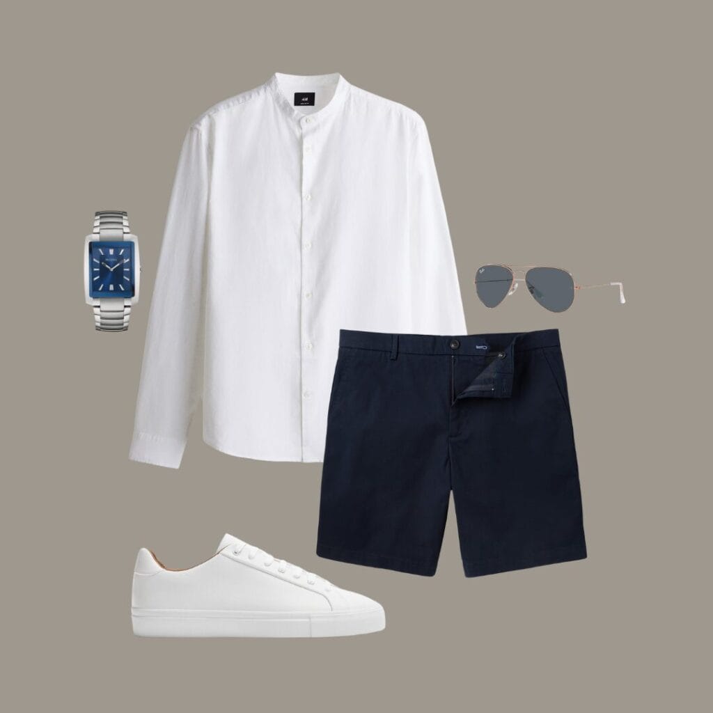 Men's Casual summer outfit for outdoor lunches, casual dates, or evening walks along the beach, featuring a white linen button-down shirt, navy cotton shorts, clean white sneakers, a minimal watch, and classic sunglasses.