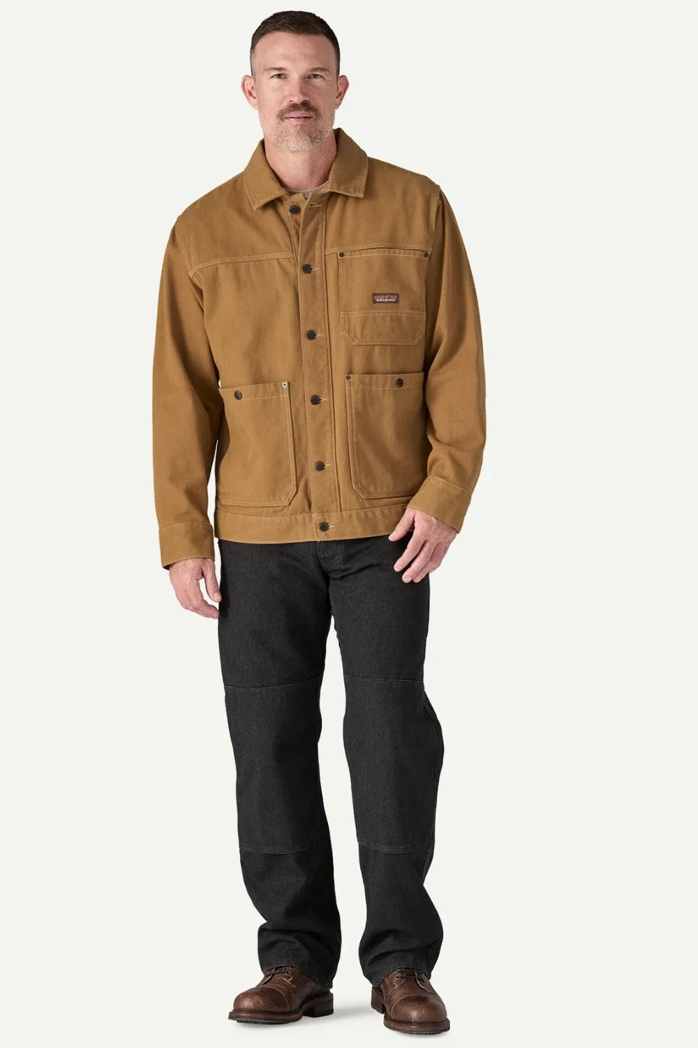 Model wearing Patagonia Iron Forge Hemp® Canvas Chore Coat in brown