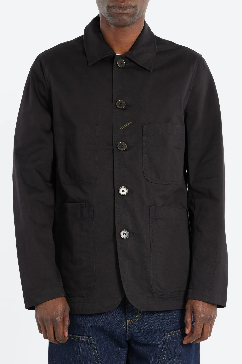 Model wearing Universal Twill Bakers Jacket in black