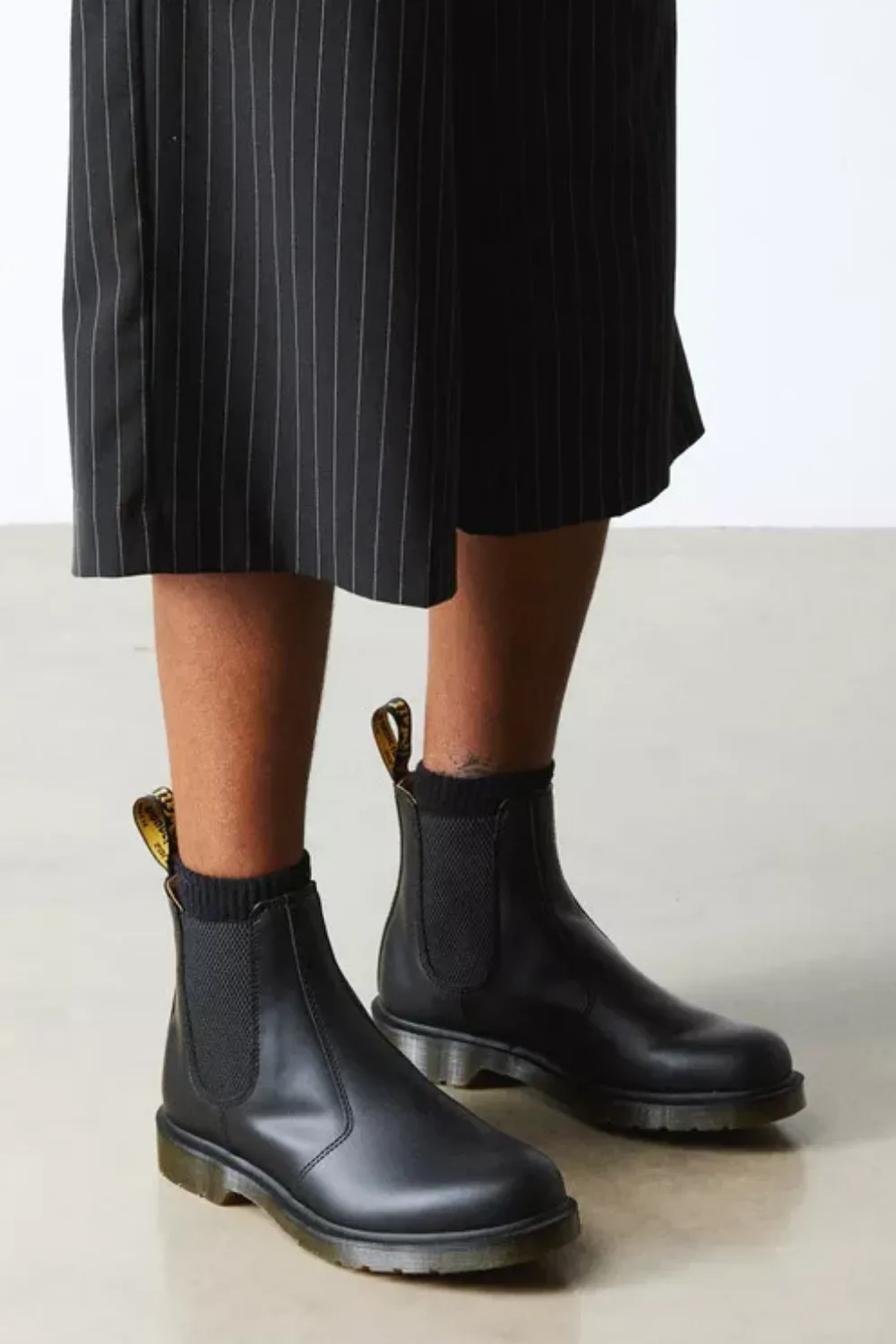Man Wearing Dr. Martens 2976 Smooth Leather Chelsea Boots in Black