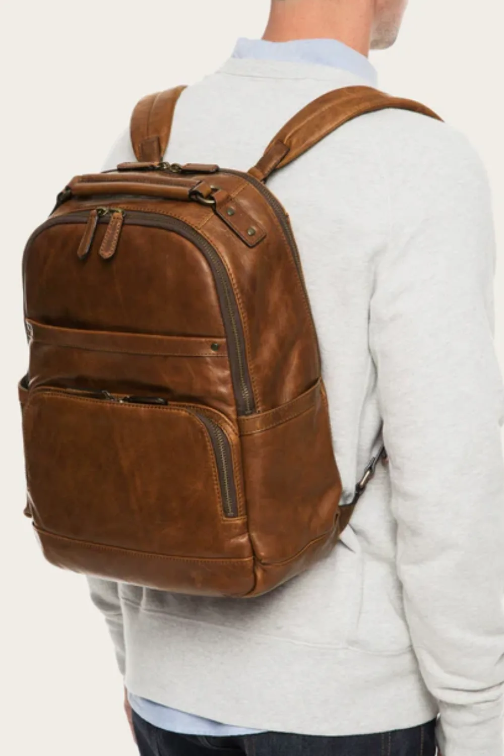 Man Wearing Frye Logan Backpack in Cognac