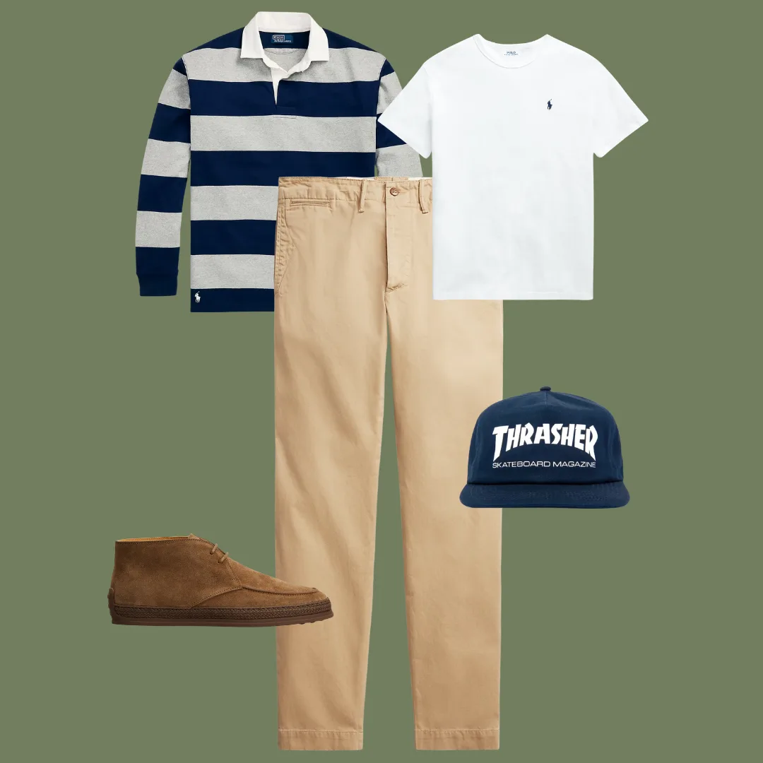 Flat lay of straight-leg chinos, a white crewneck T-shirt, a striped rugby shirt, suede desert boots, and a Thrasher cap.