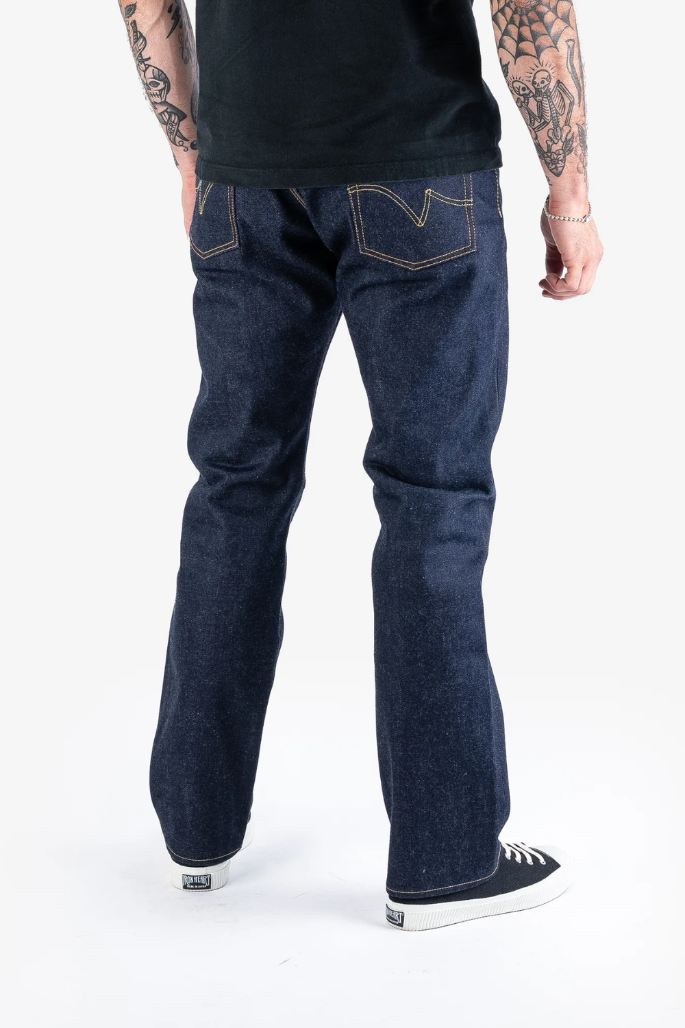 A man wearing Iron Heart 21/23 oz Ultra Heavy Raw Selvedge Denim Jeans, shown from the back.