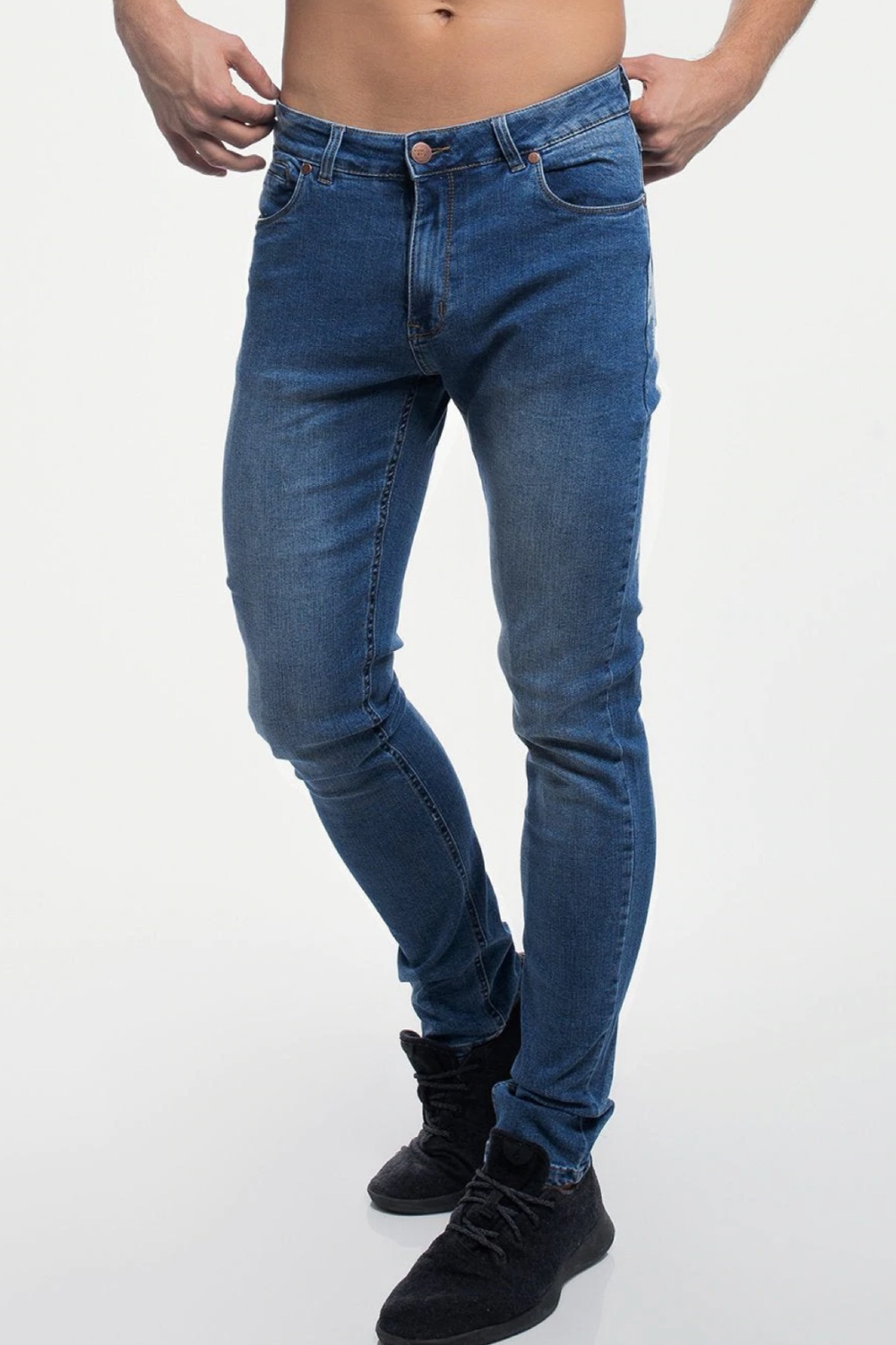 A man wearing Barbell Apparel Straight Athletic Fit Jeans in Blue, shown from the front.