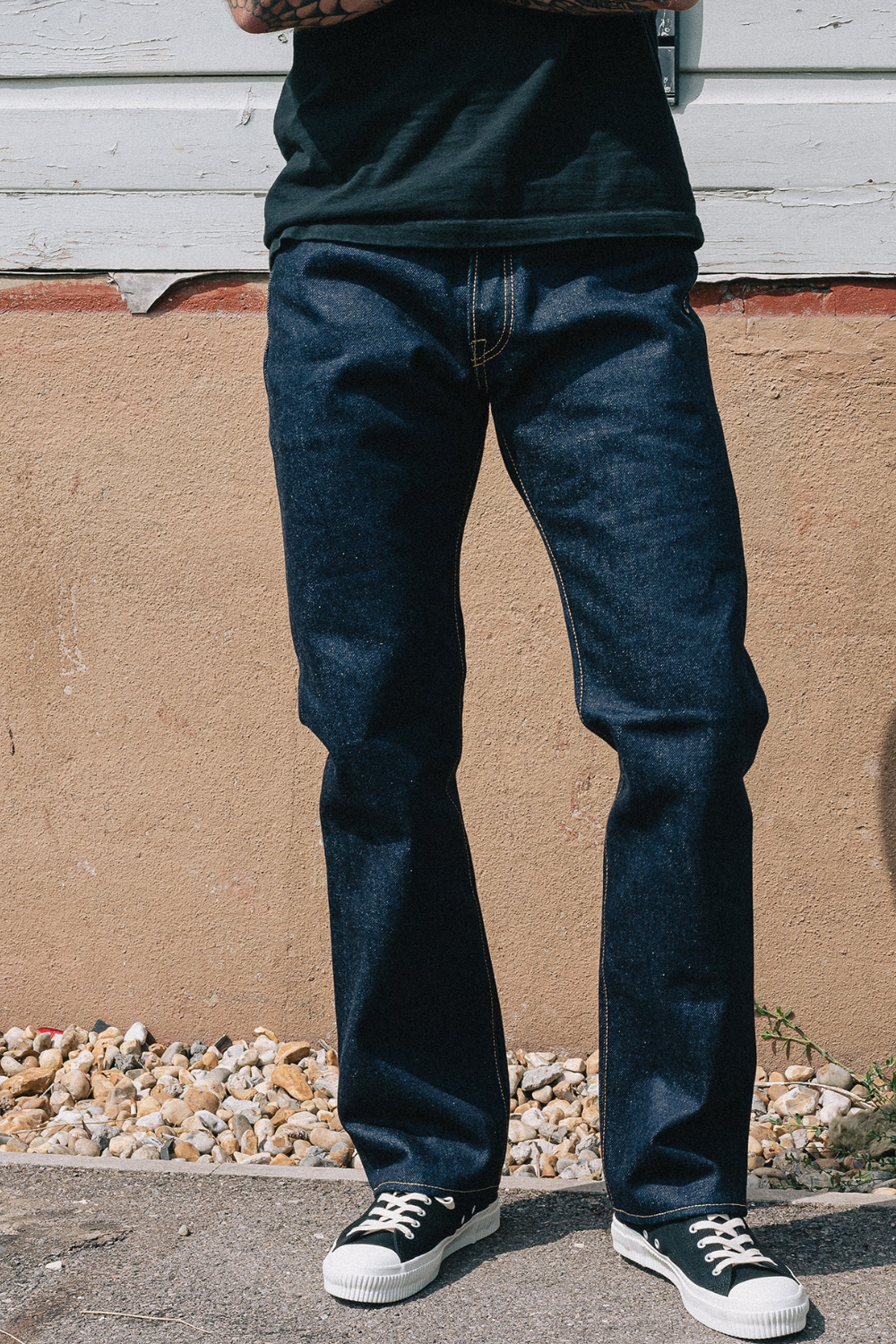 A man wearing Iron Heart 21/23 oz Ultra Heavy Raw Selvedge Denim Jeans, shown from the front.