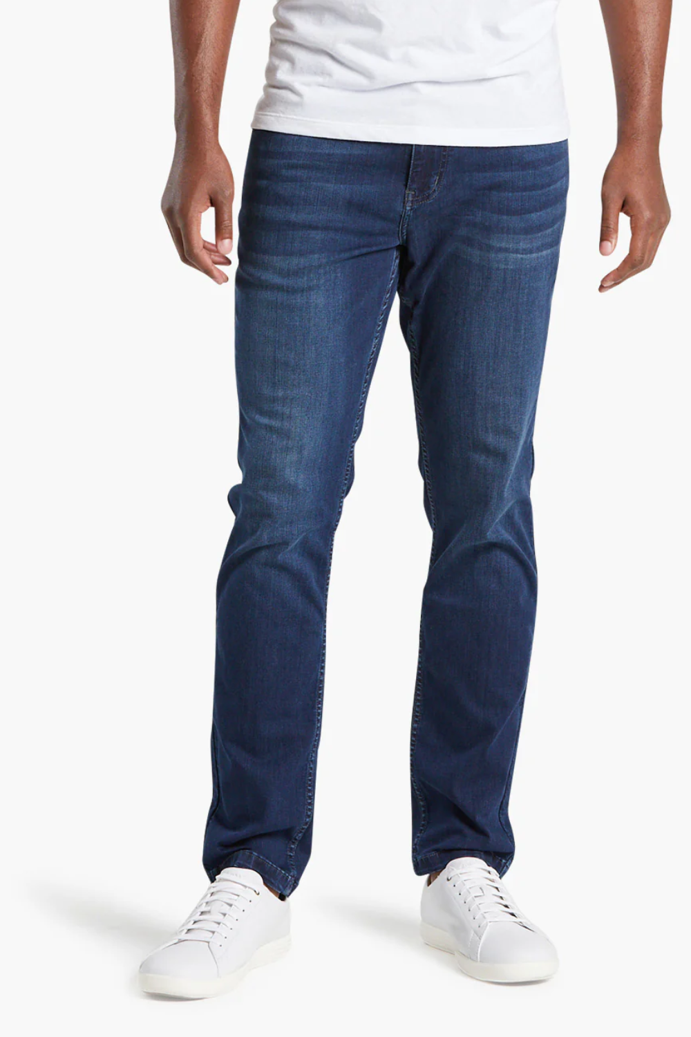 A man wearing Mugsy Fulton Stretch Denim Jeans in blue, shown from the front.