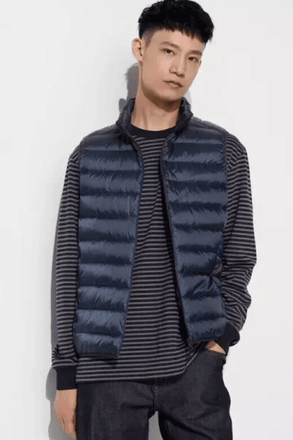 Man wearing Uniqlo Ultra Light Down Vest in navy