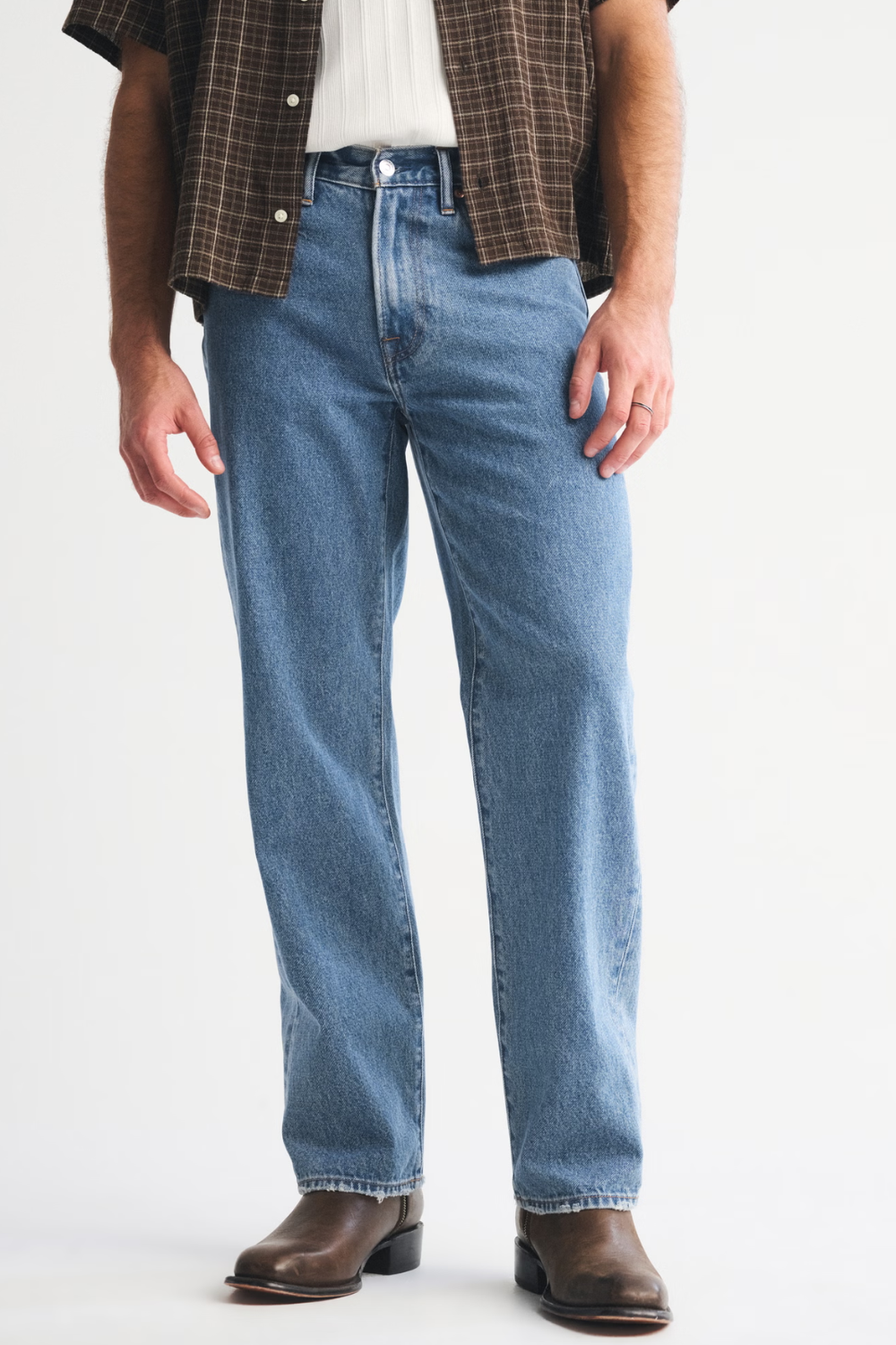 Man Wearing Abercrombie & Fitch Relaxed Straight Jean in Medium Wash