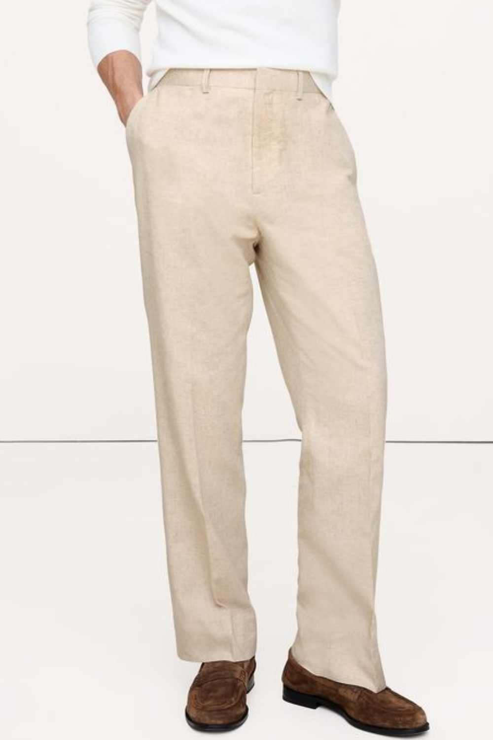 Man Wearing Banana Republic Men's Herringbone Cotton-Linen Relaxed Suit Pant in Beige
