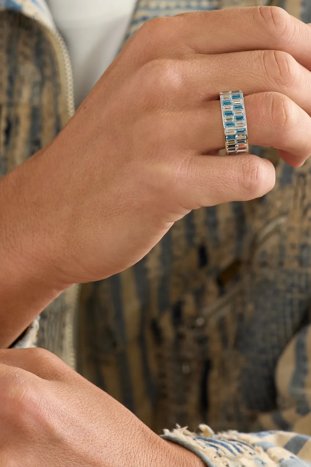 Close-up shot of a man’s hand wearing the HATTON LABS Mirage Silver Cubic Zirconia ring, featuring a fully polished silver body encrusted with sparkling cubic zirconia stones that reflect the light.