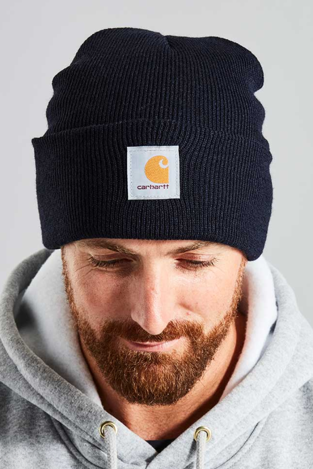 Man Wearing Carhartt A18 Knit Cuffed Beanie in Black
