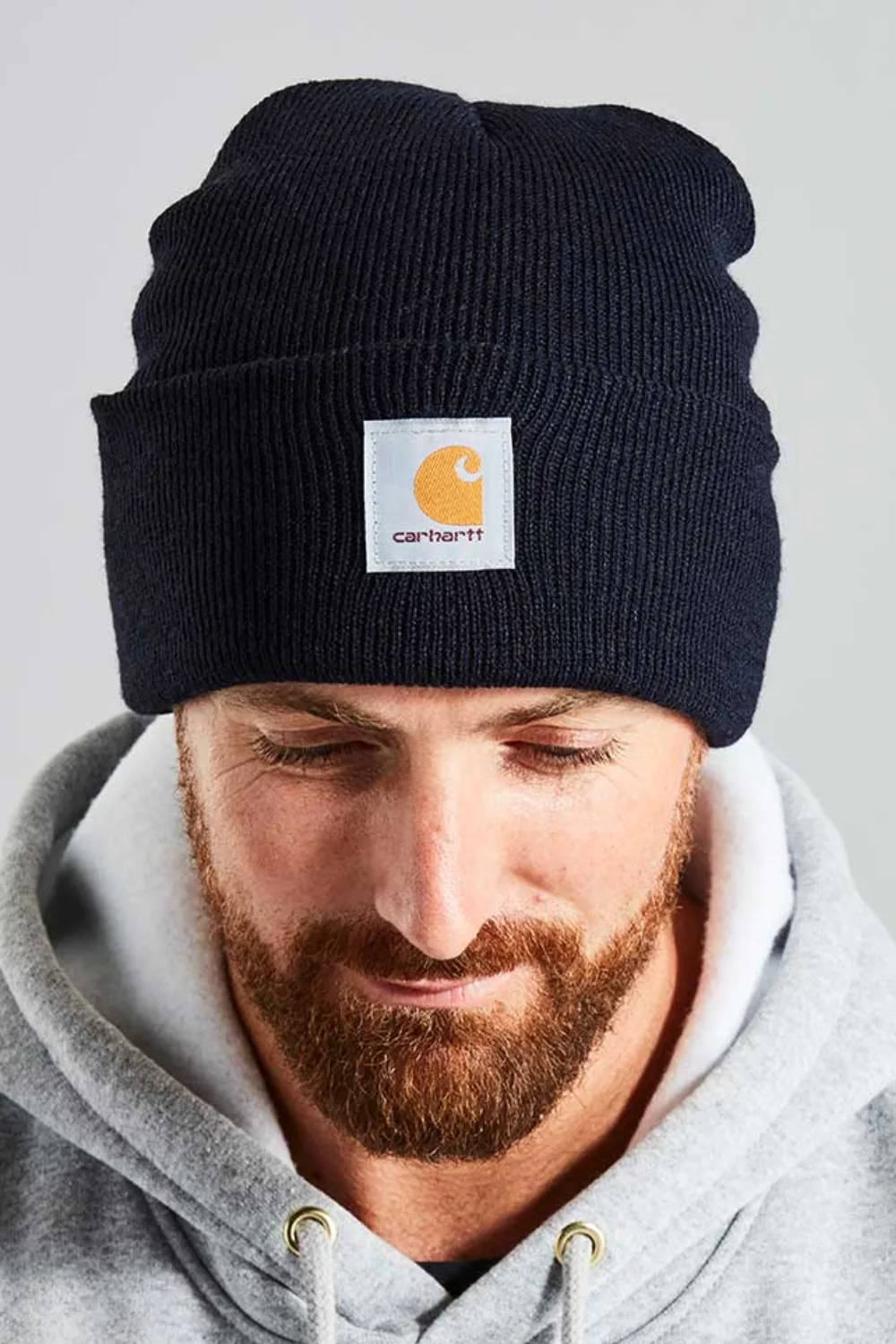Man Wearing Carhartt A18 Knit Cuffed Beanie in Black