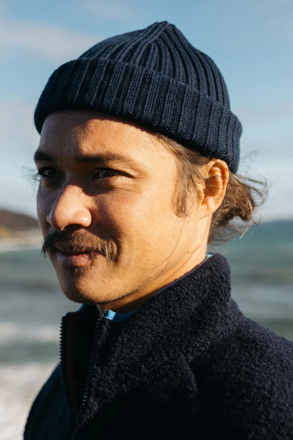 Man Wearing Finisterre Fisherman Beanie in Navy