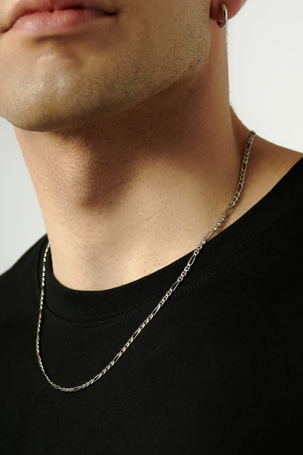 Close-up of the Missoma Men’s Filia Curb Chain Necklace, showing its polished silver links with a smooth, weighty finish.