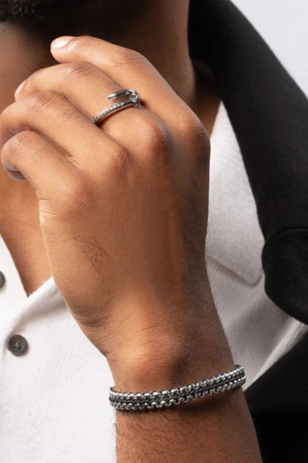 Close-up of the Nialaya Stainless Steel Woven Box Chain Bracelet with interlaced silver links, combining shine and structure.