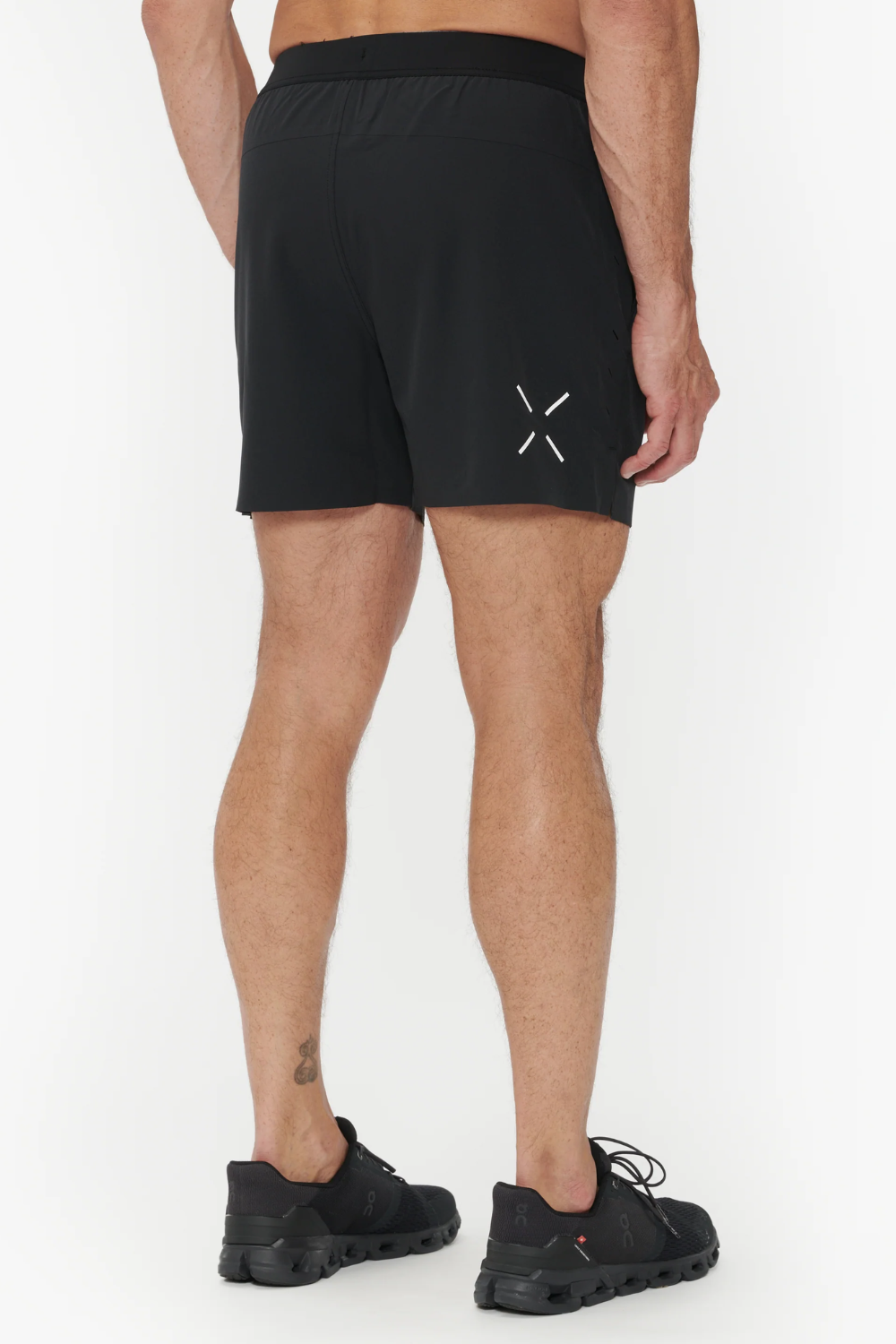 Man Wearing Ten Thousand Interval Shorts in Black