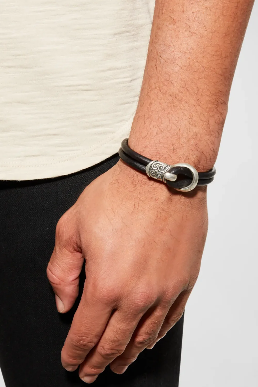 Close-up of the John Varvatos Leather Buckle Bracelet, showing its rich dark leather and aged metal buckle.