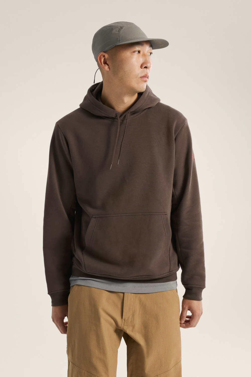 Man Wearing Arc’teryx Emblem Fleece Hoody in Carob