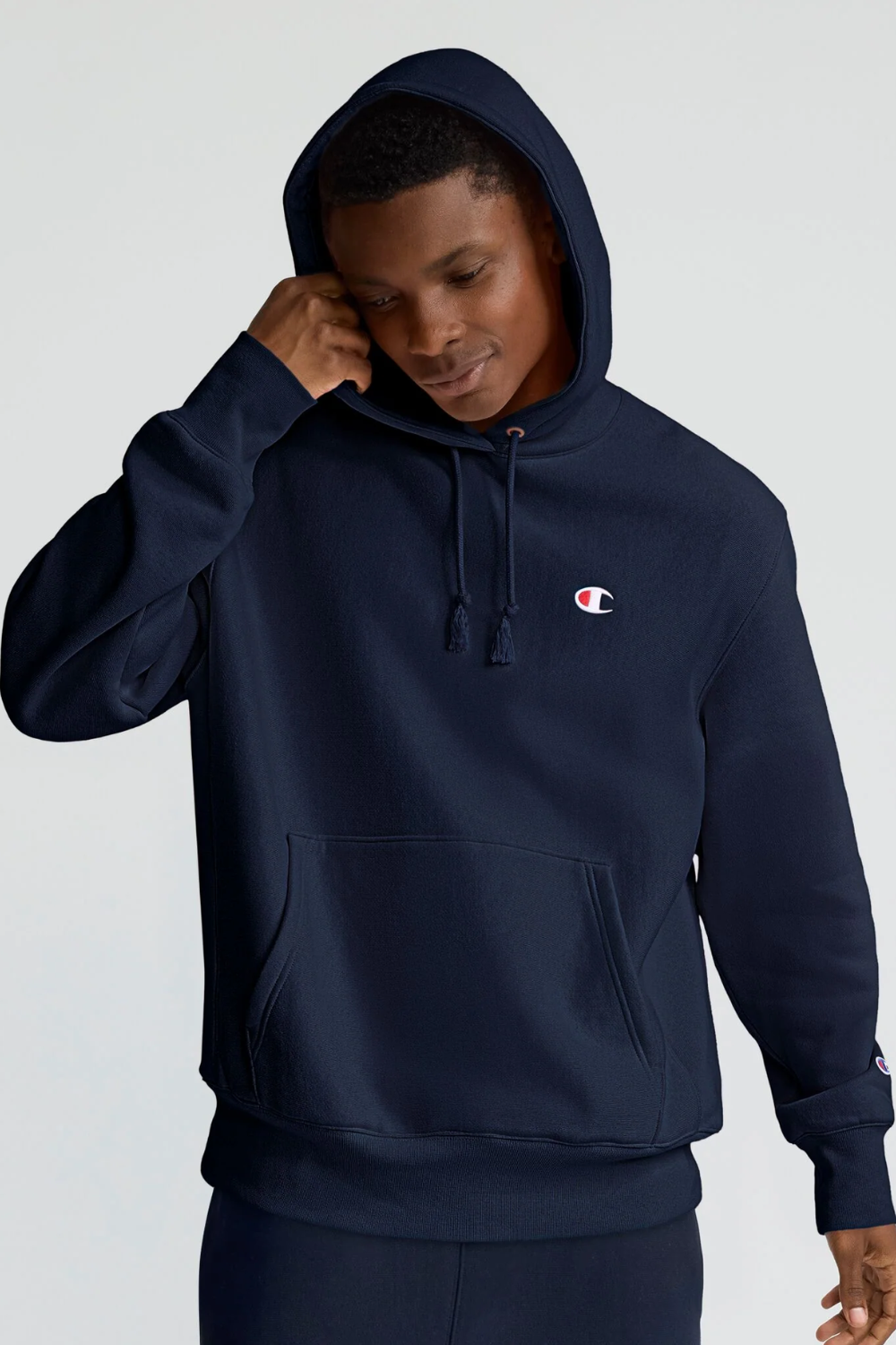 Man Wearing Champion Reverse Weave Hoodie in Navy