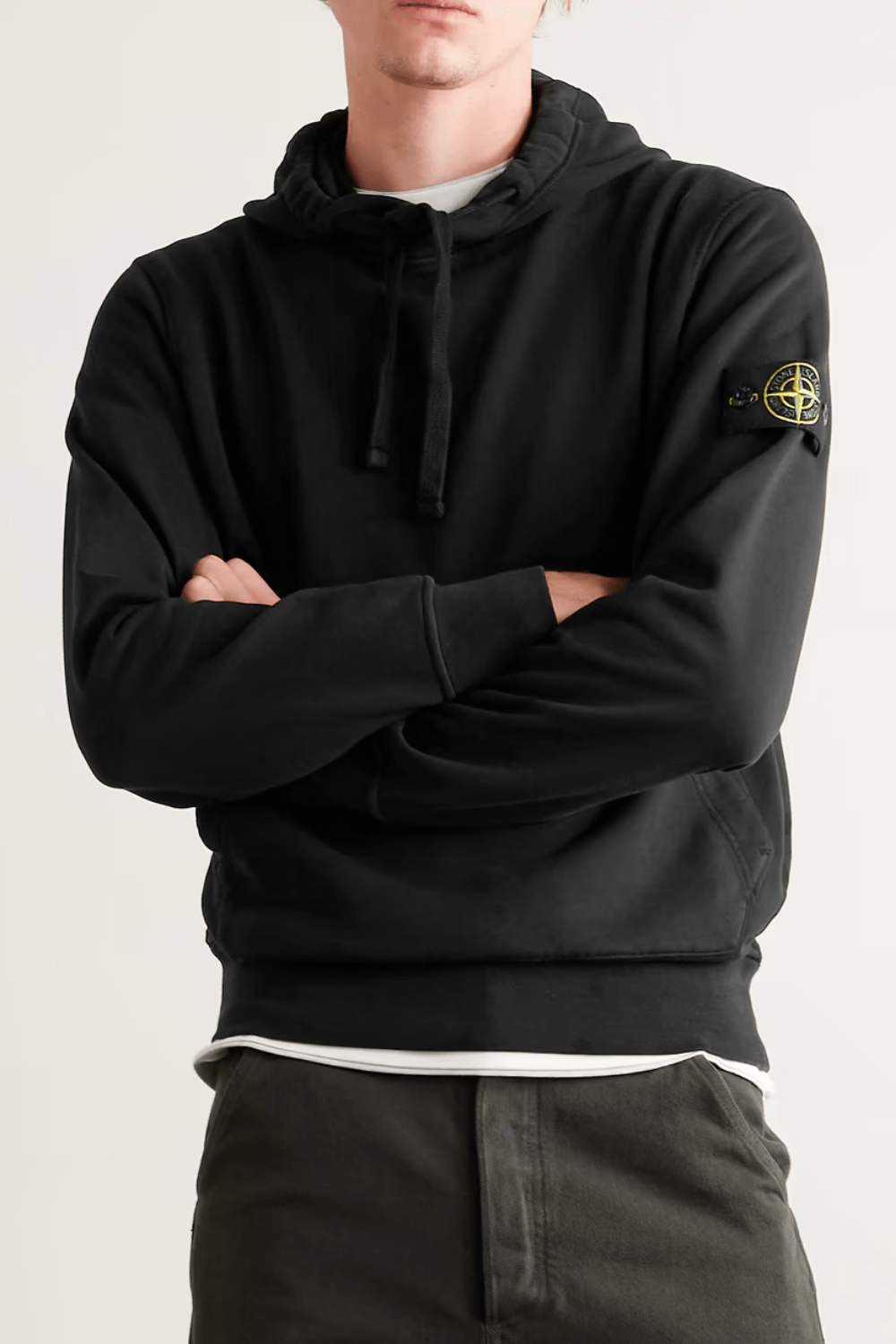 Man Wearing Stone Island Logo-Appliquéd Cotton Hoodie in Black
