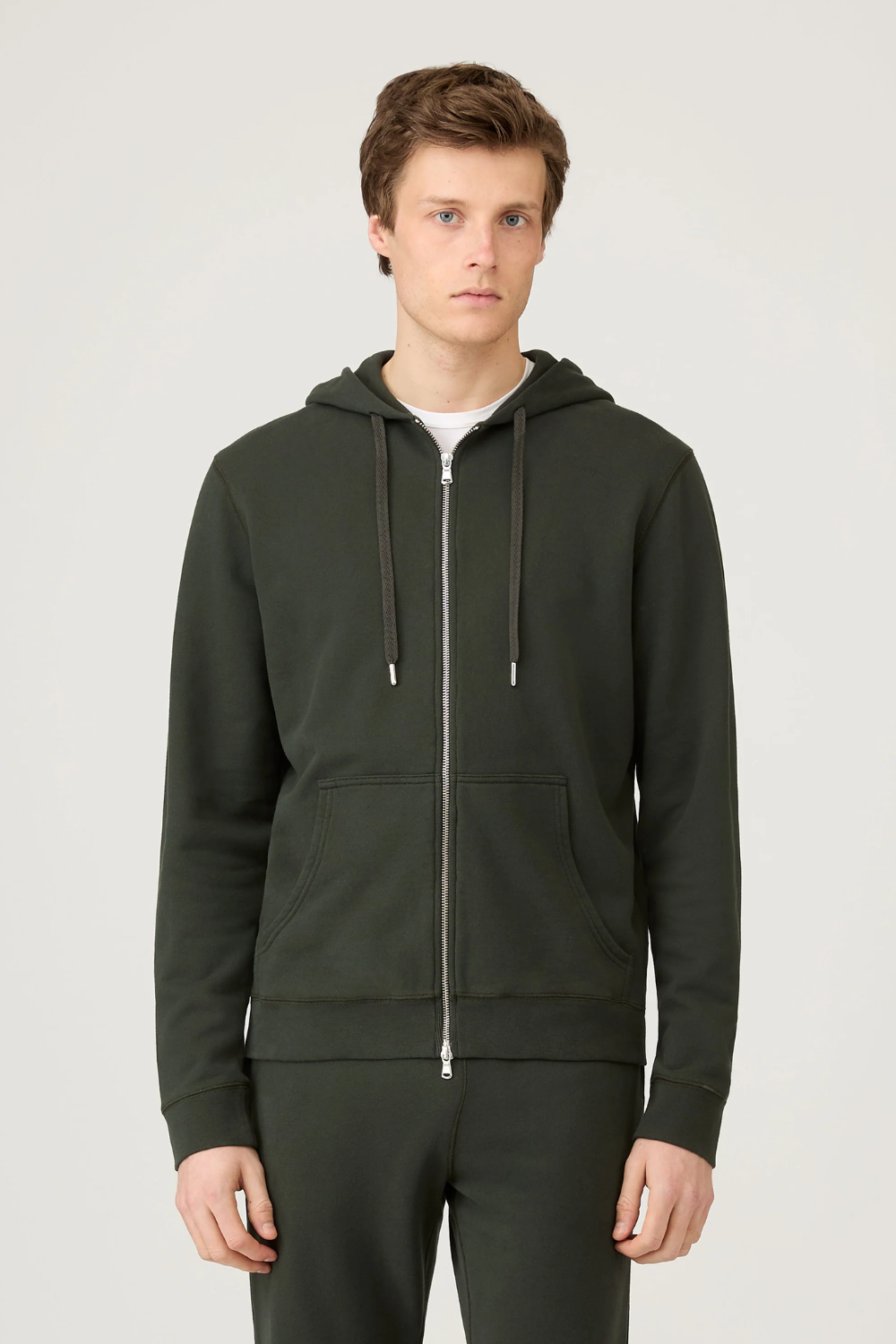 Man Wearing Sunspel Loopback Zip Hoodie in Dark Green