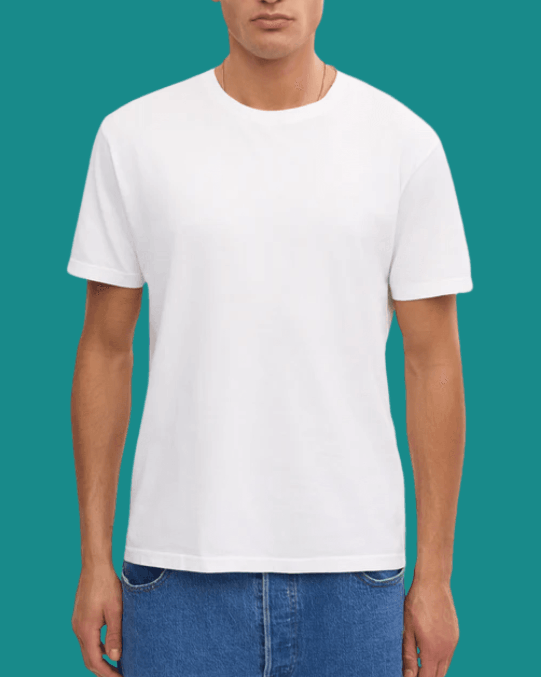 Man wearing Colorful Standard Classic Organic White Tee, standing casually with arms relaxed at his sides.