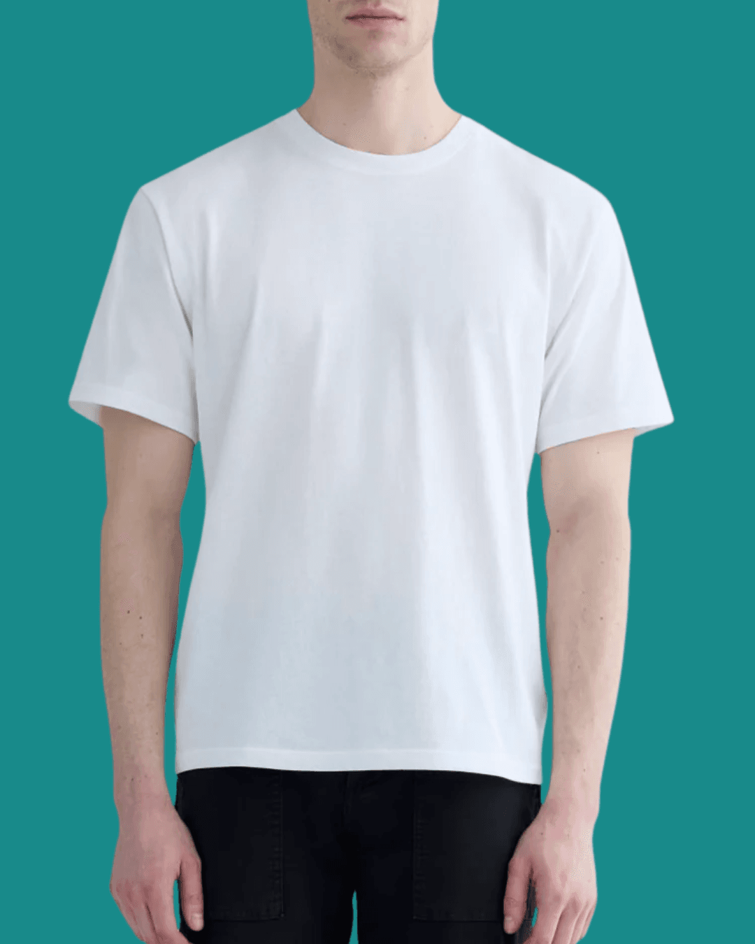 Man wearing Everlane Premium-Weight Relaxed White Crew, standing casually with arms relaxed at his sides.