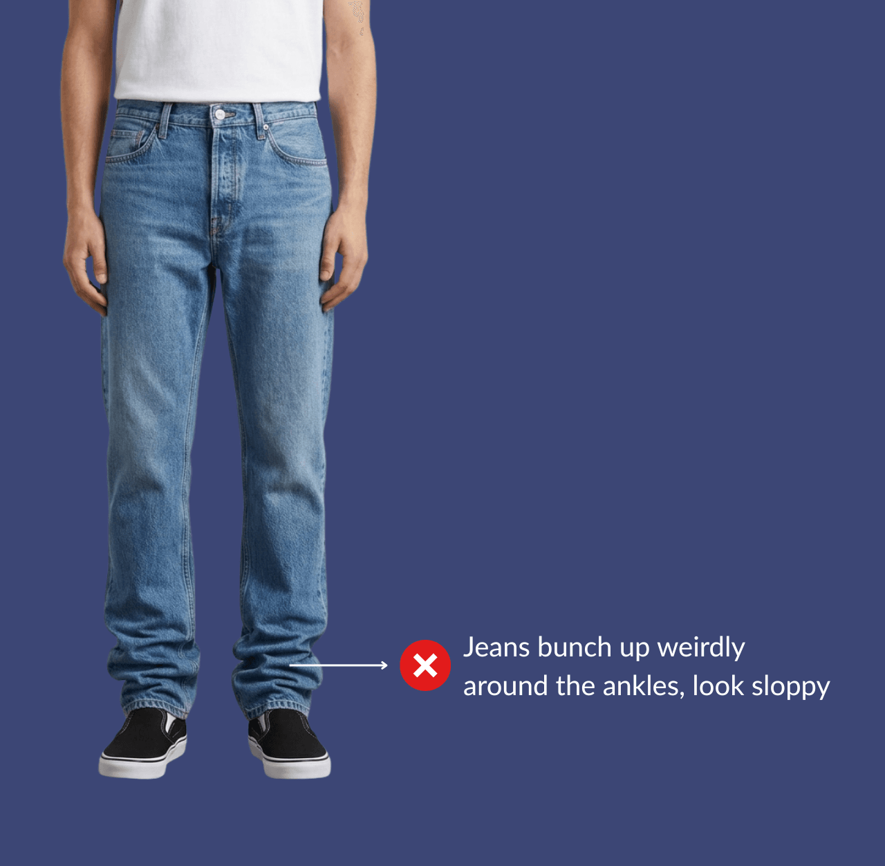 Man wearing blue straight-fit jeans and black canvas sneakers, standing casually with arms relaxed at his sides.