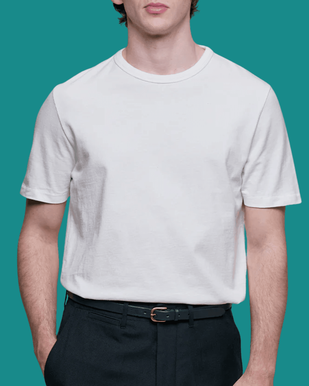 Man in Merz b. Schwanen Classic Cotton Jersey White T-Shirt with a hand in pockets, standing casually.