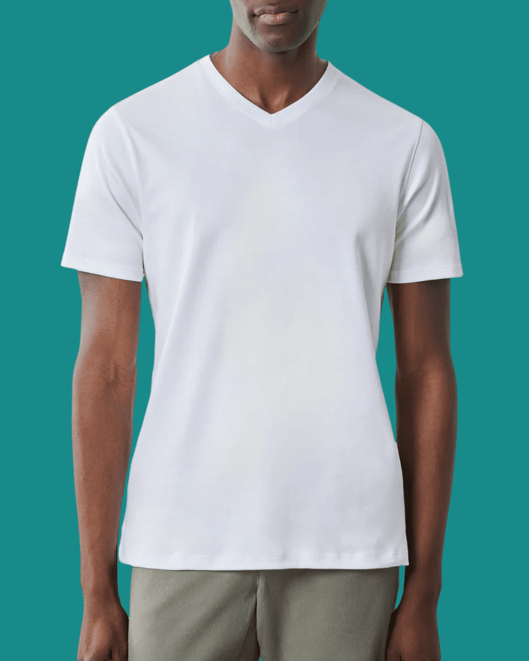 Man wearing Robert Barakett The Barakett V Tee in White, standing casually with arms relaxed at his sides.
