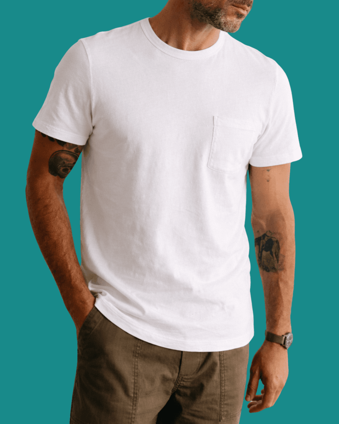 Man in Taylor Stitch Organic Cotton Pocket Tee with a hand in pockets, standing casually.