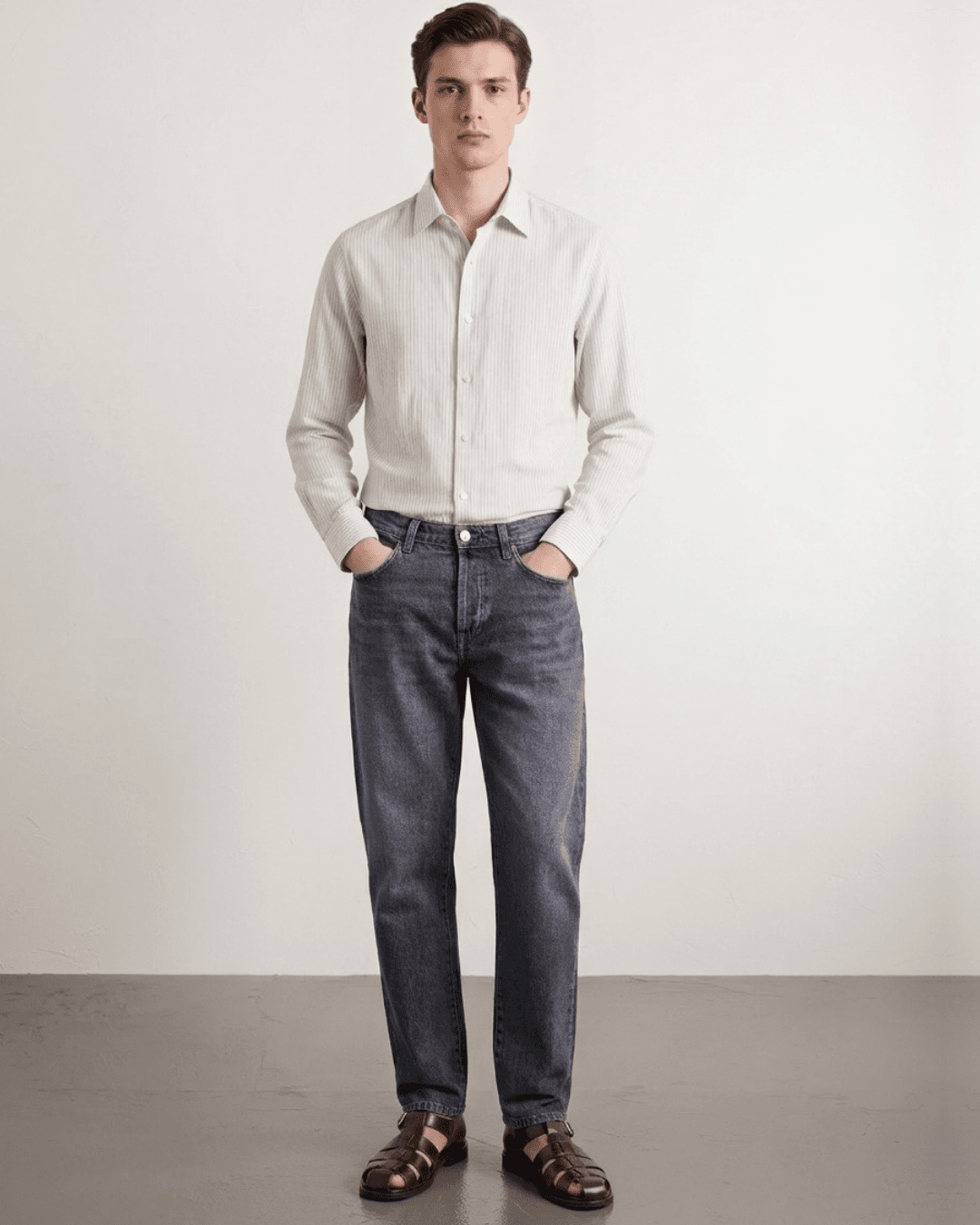 Man Wearing sandals with cropped jeans in a medium wash