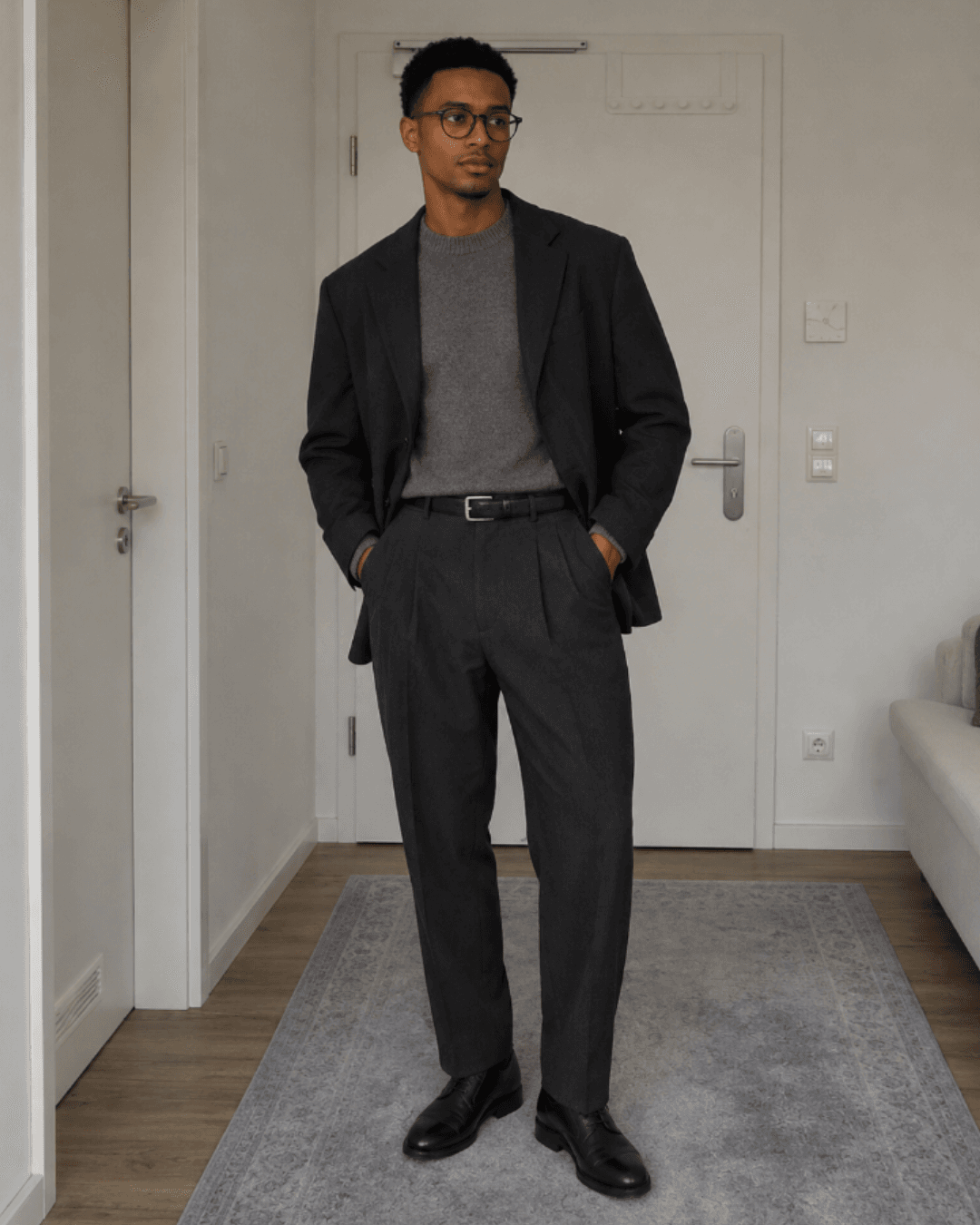 Fall Business-Casual Office Ooutfit with an unstructured blazer, a fine-gauge knit sweater, pleated wool trousers, and leather derby shoes